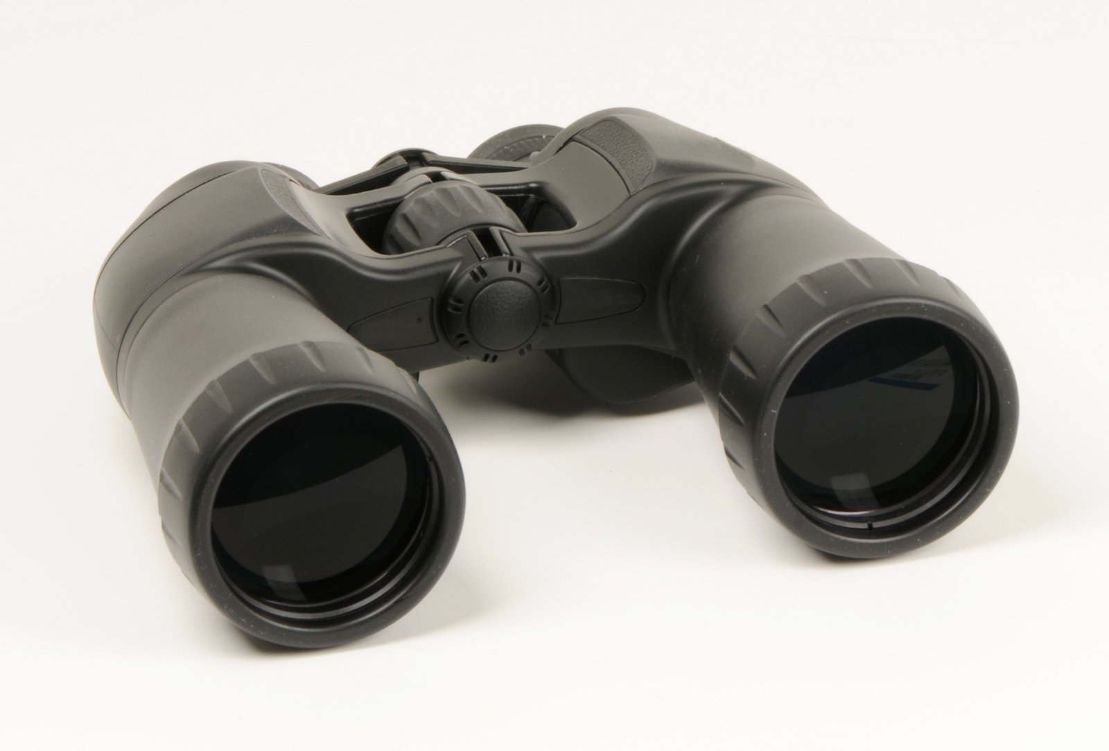 a pair of black binoculars on a white table