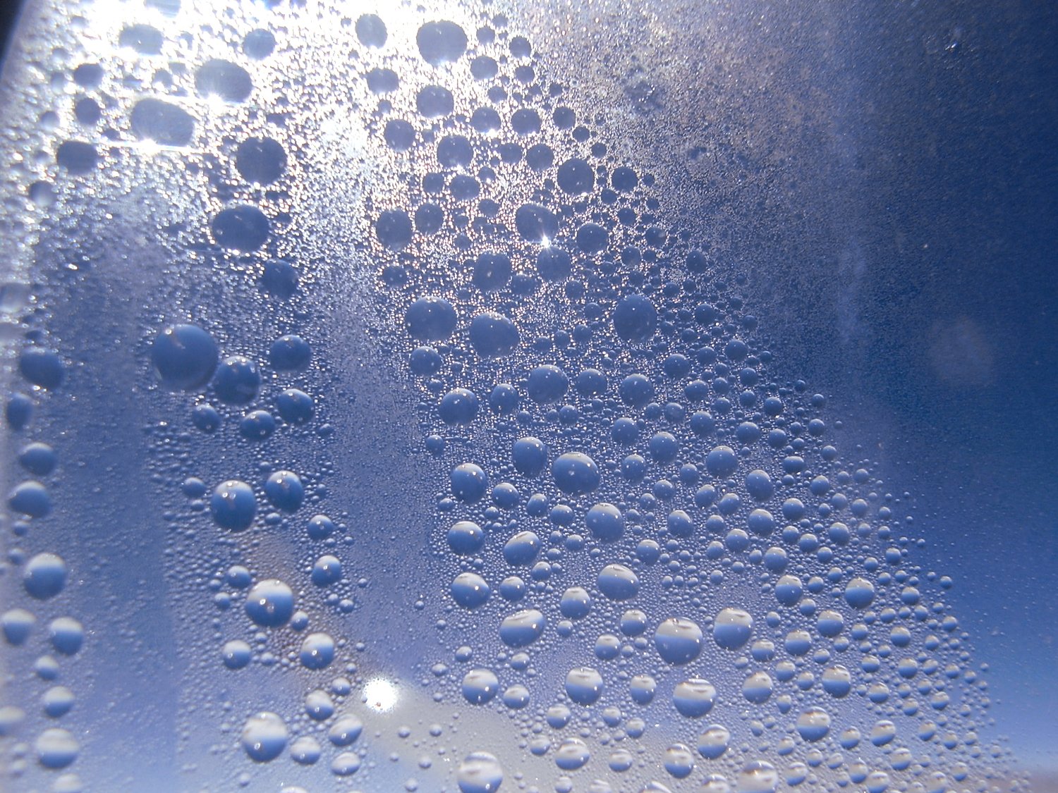 bubbles of water are being made into a blue sky