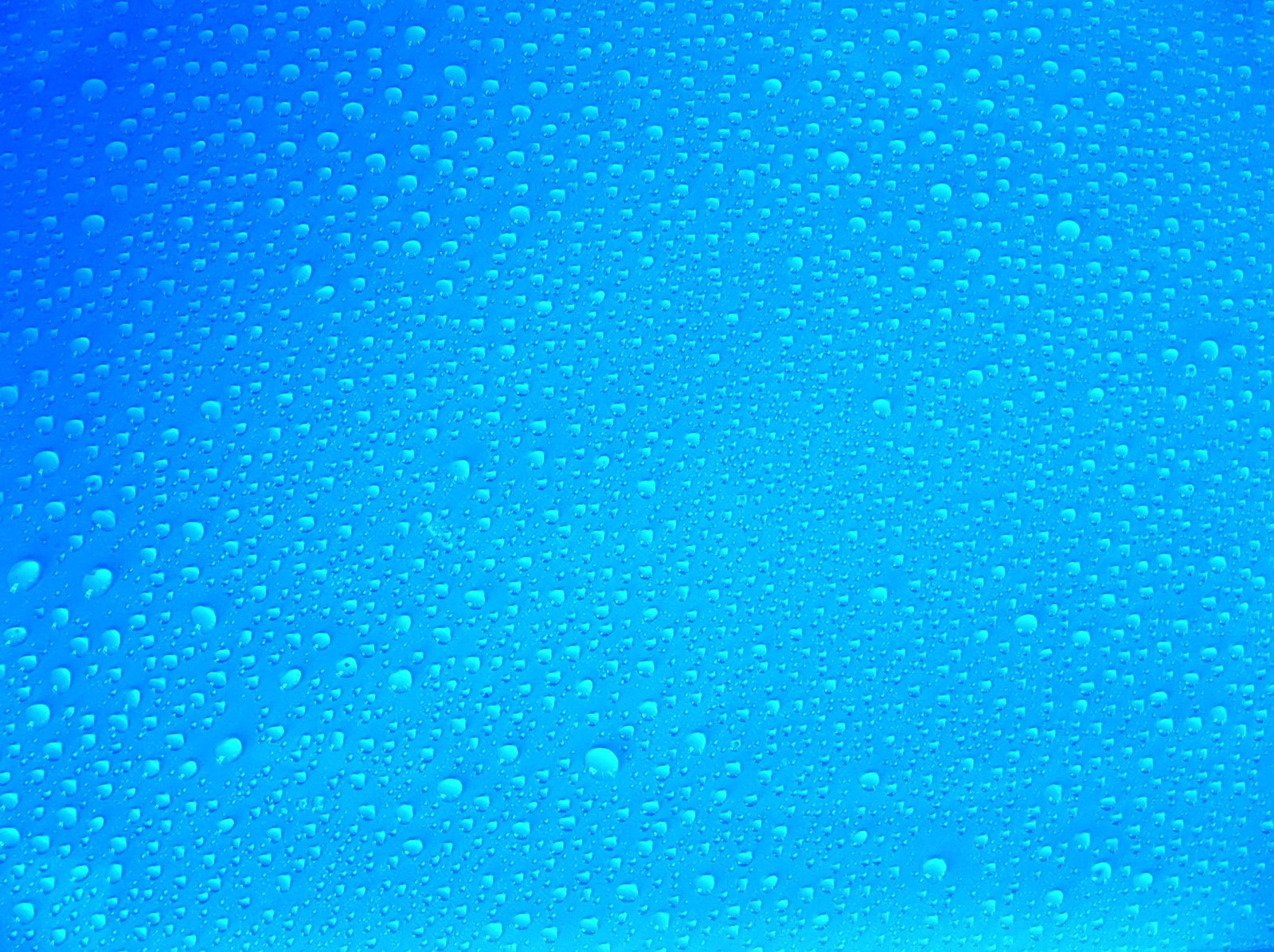 some water droplets are sitting on the glass