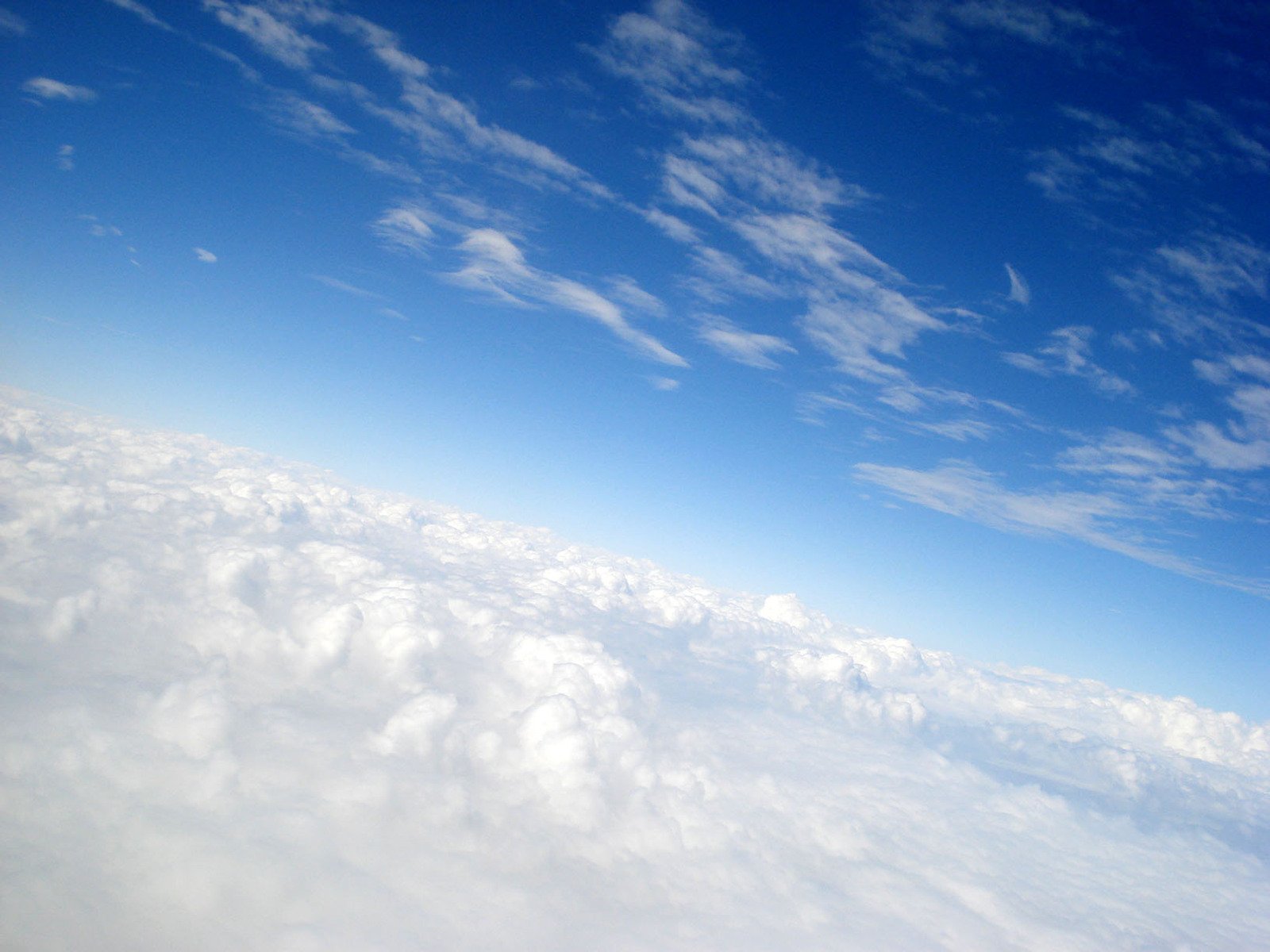 the view from an airplane over some very white clouds