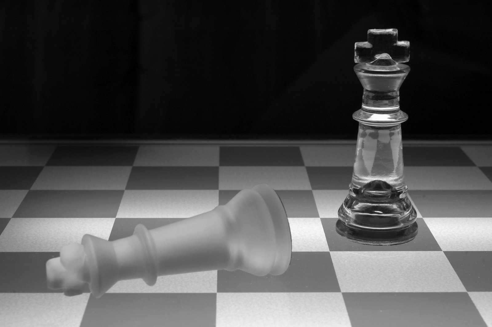two pieces of chess on the table are being pographed