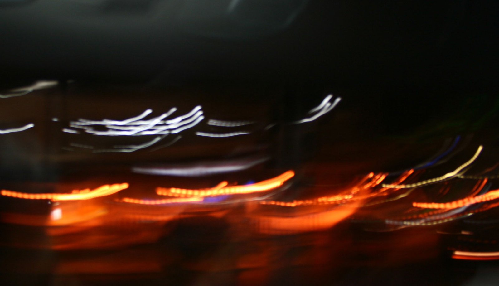 the picture shows blurry motion of some lights in a dark room