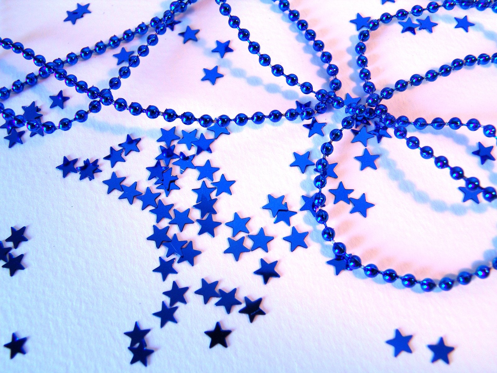 blue stars and bead necklaces are all flying together