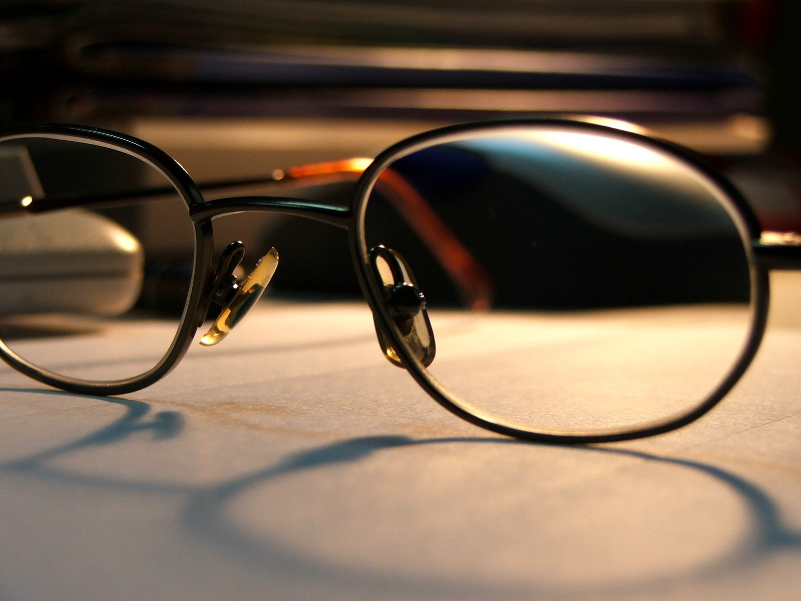 an empty pair of glasses lying on a surface