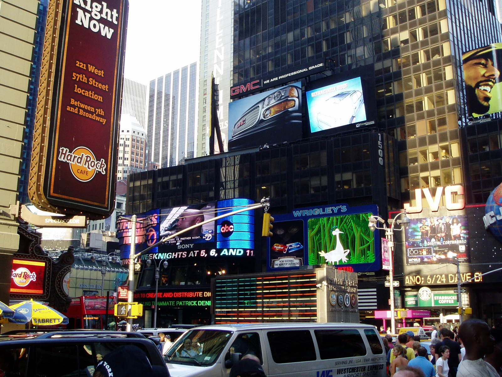 a street with lots of large buildings and signs