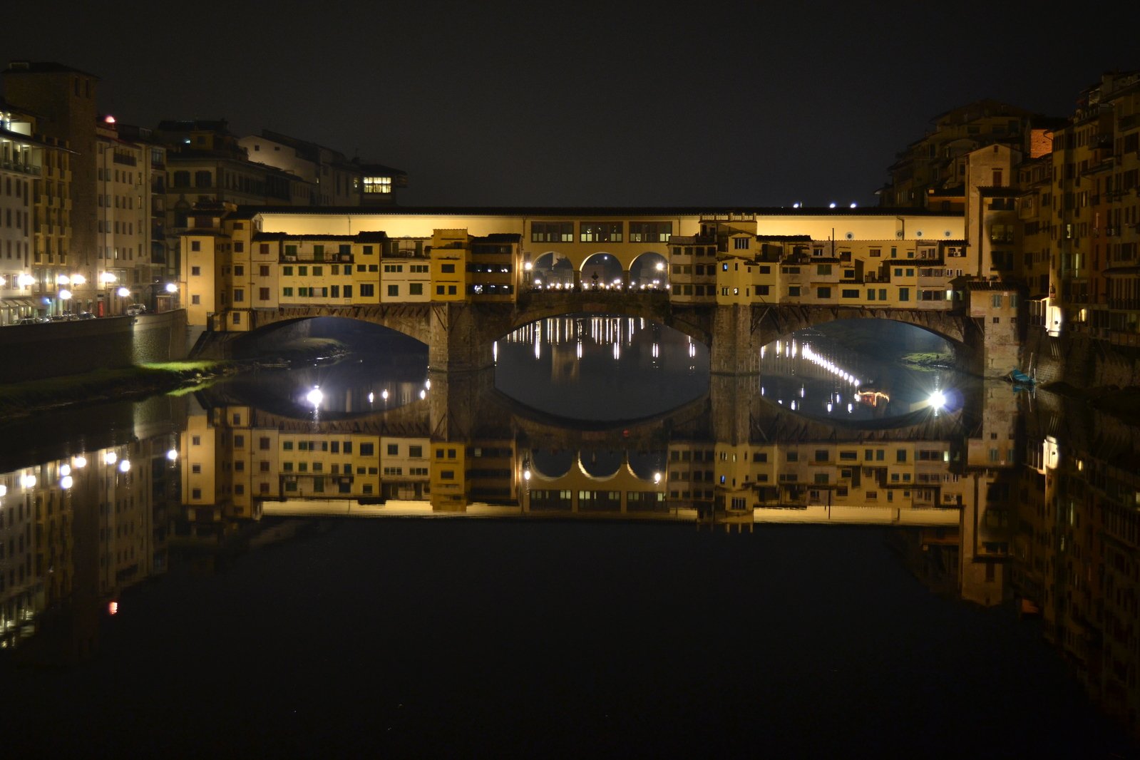 a bridge that is over a river at night