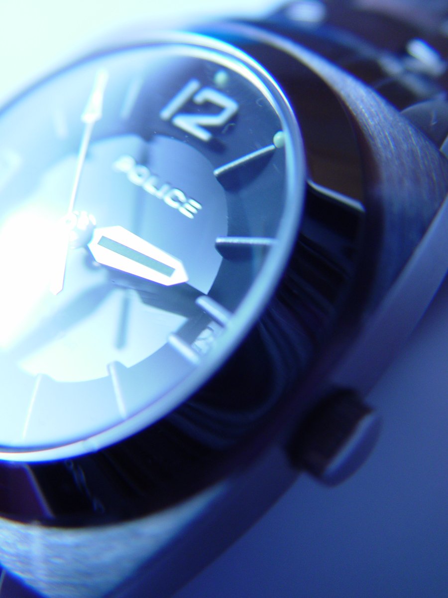a closeup of the face and wrist of a watch