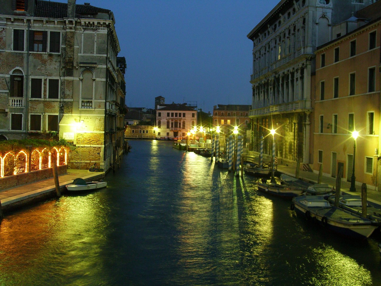 a canal in the city with several lights along it
