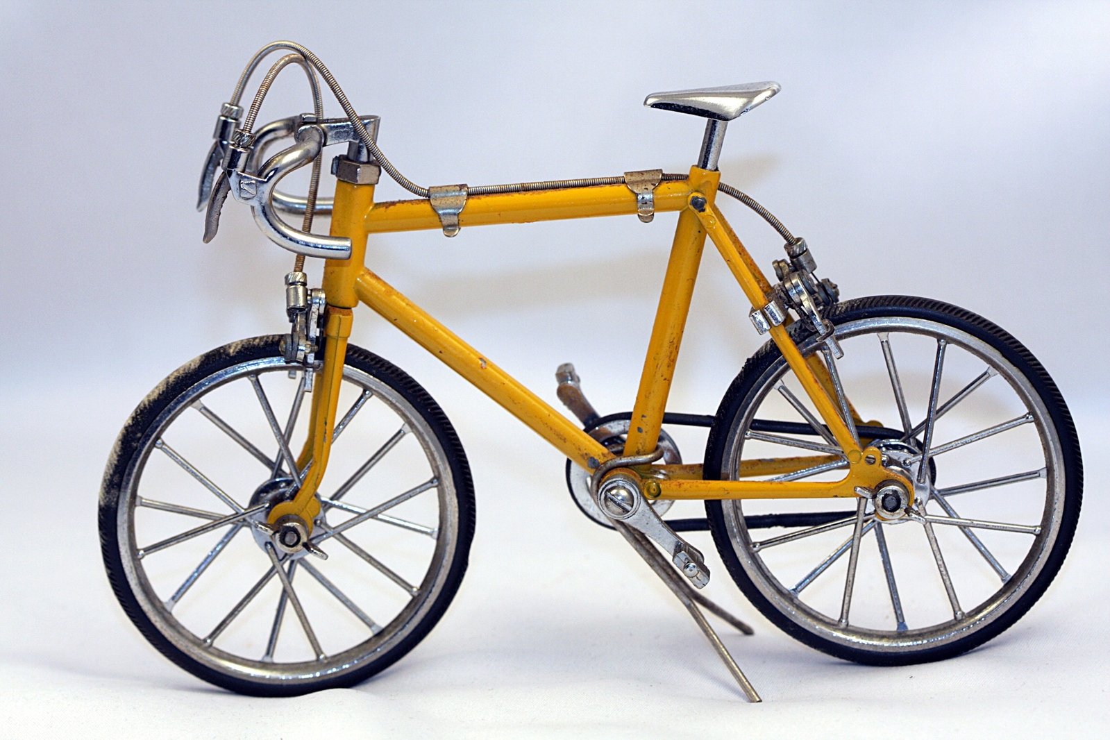 a yellow bike with some silver rims