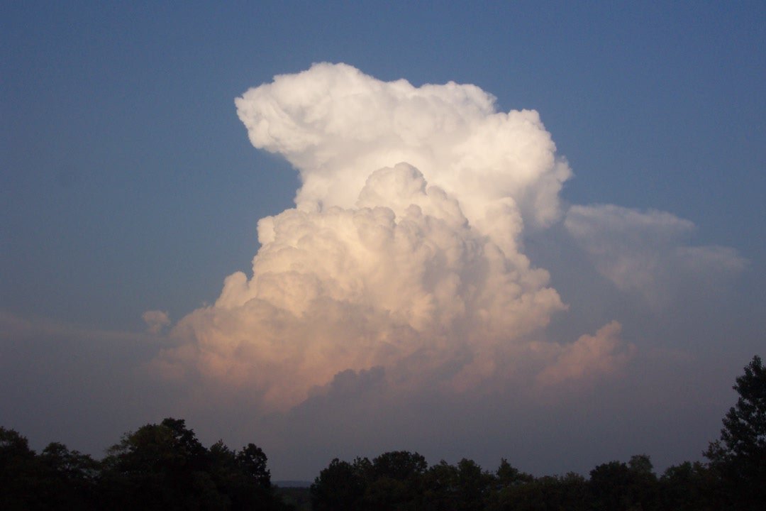 a cloud that is rising up to the sky