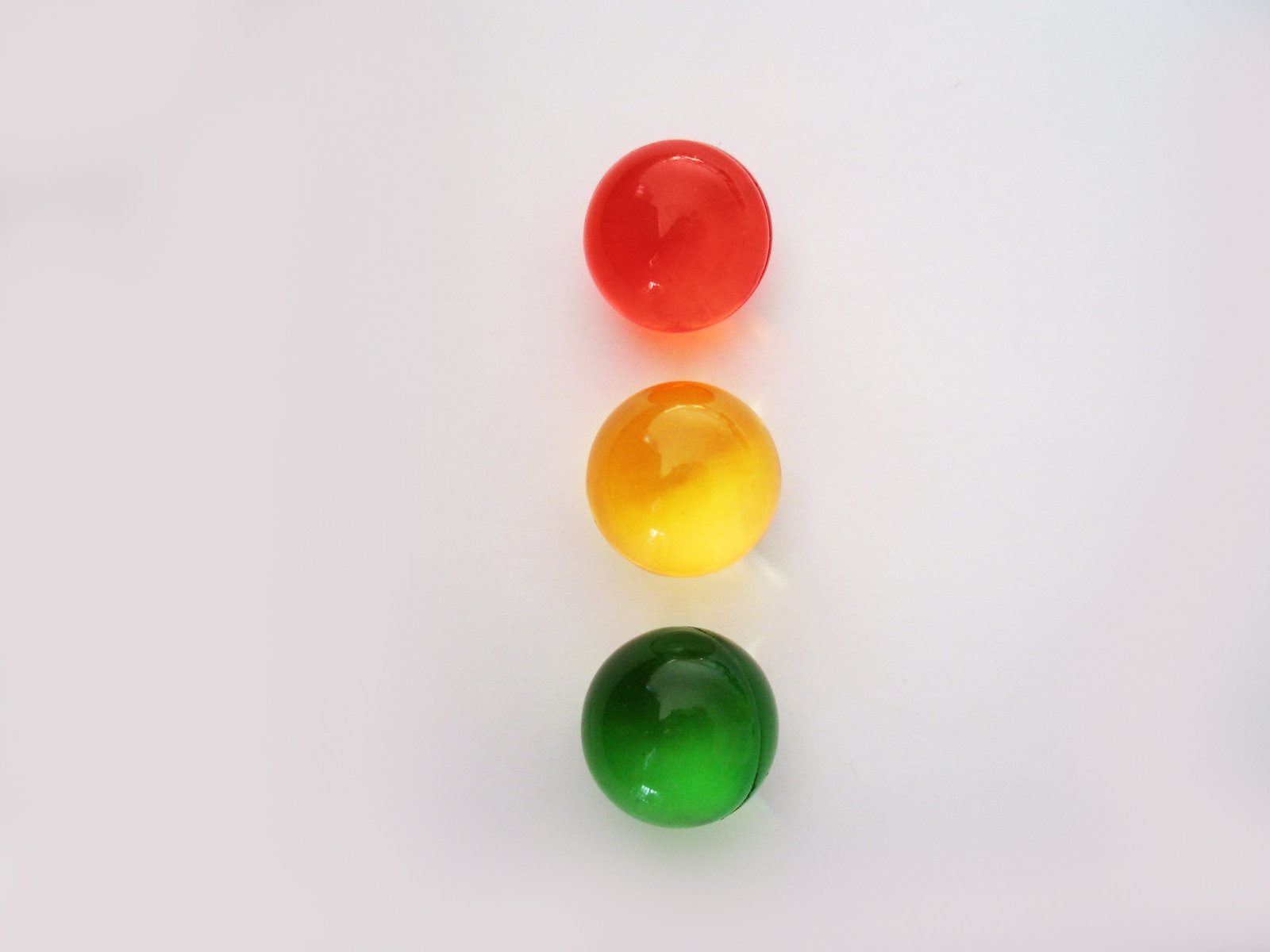 an image of three balls in the shape of number four