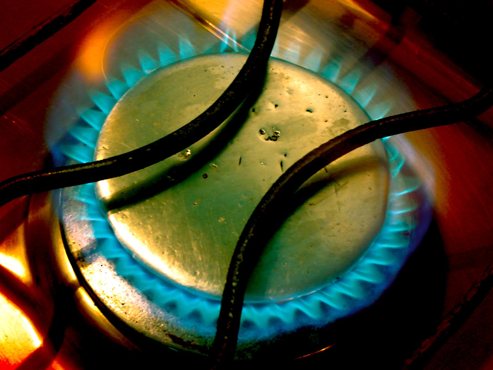 two blue and yellow burners on a stove