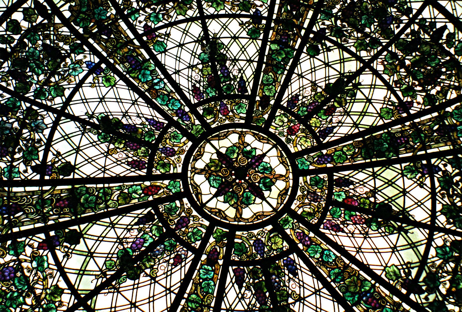 a large artistic looking glass decoration on the ceiling