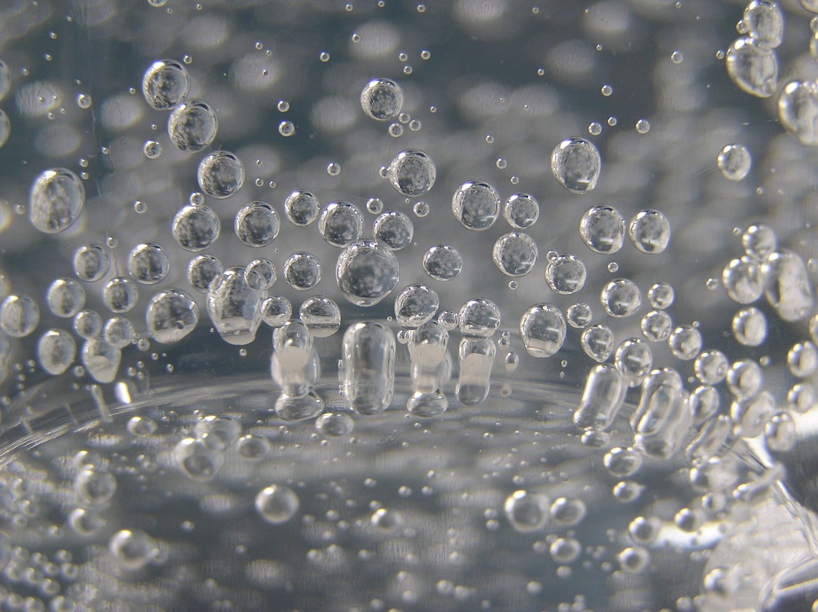 a view through some bubbles of water on the surface
