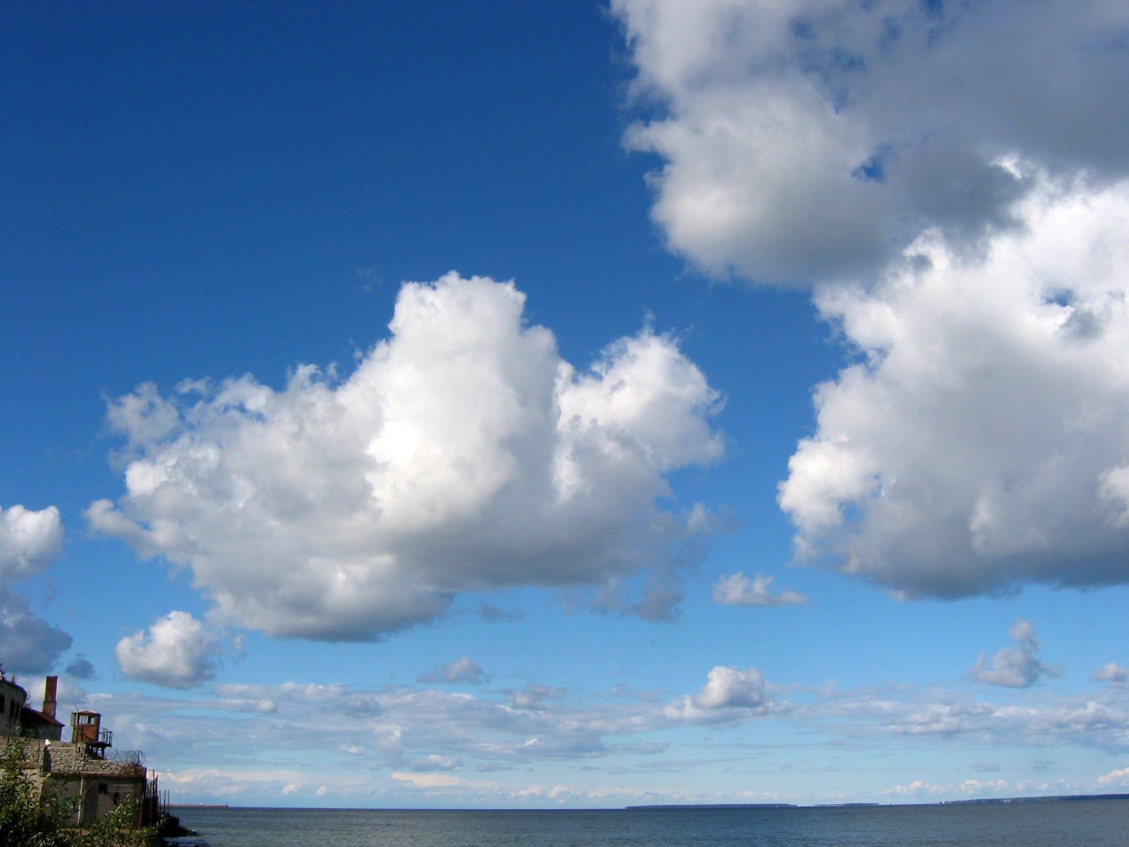 the view from a bench looking out at a ocean