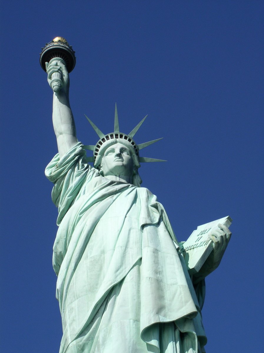 a statue of liberty holding the torch of liberty in its hands