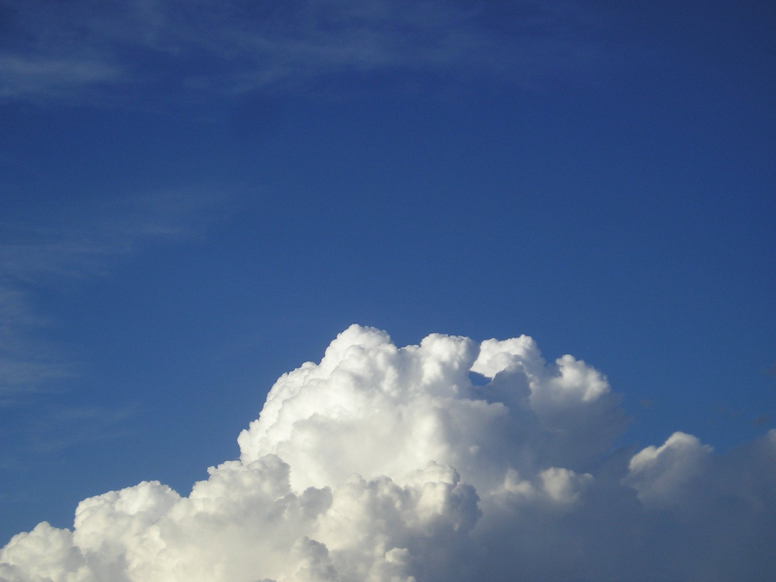 an airplane flying through a very cloudy sky