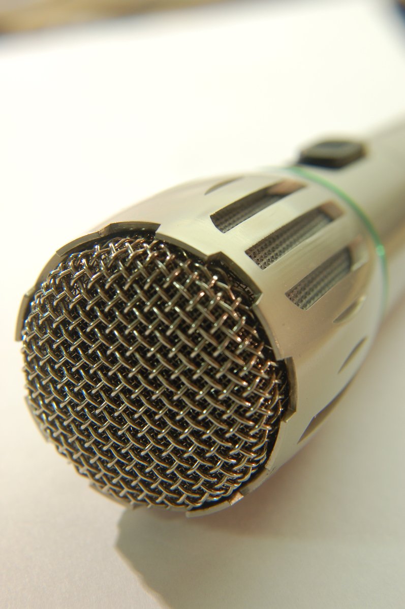 a microphone with the backlit off and it's speaker visible