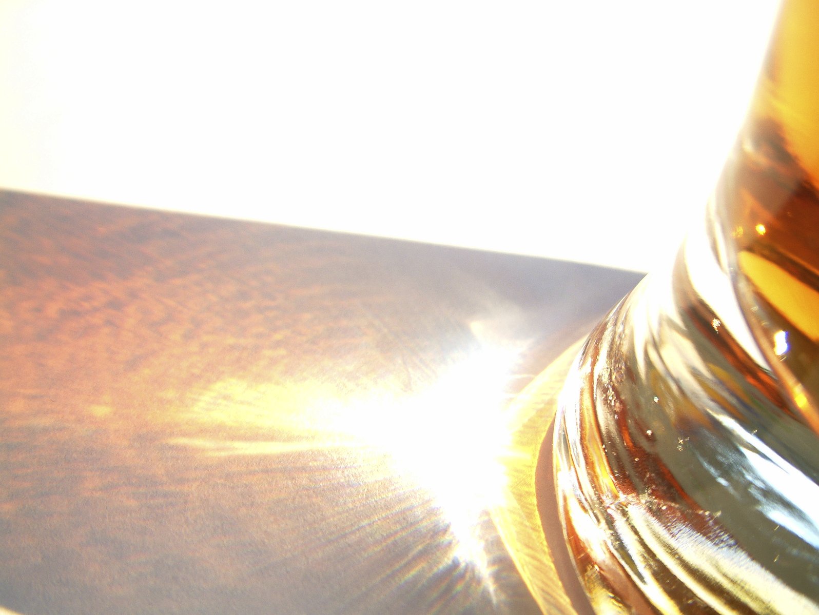 a close up s of a clear glass on a metal surface