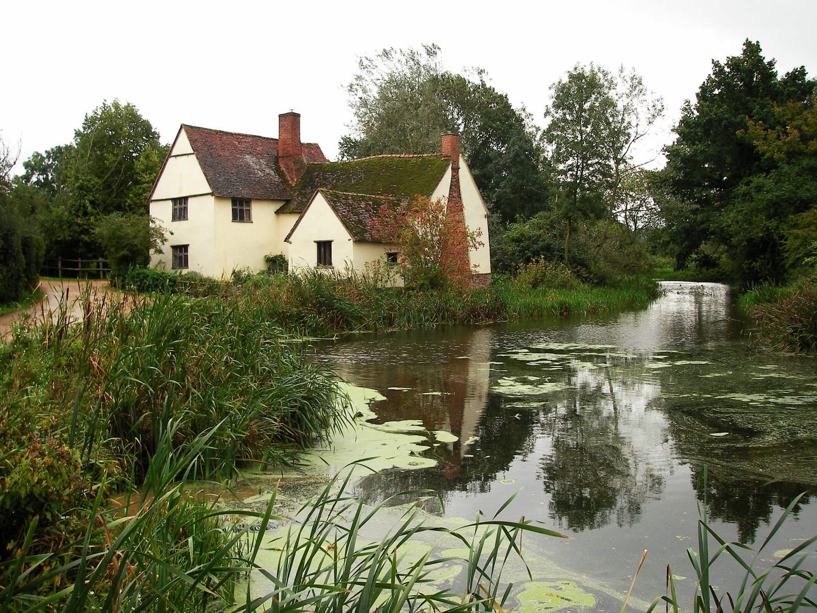 a river runs beside a house near the water