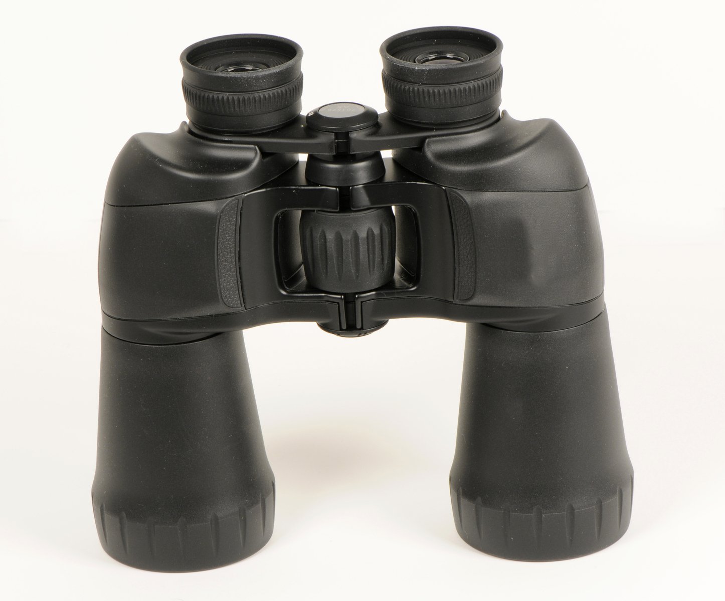two black binoculars are on the ground