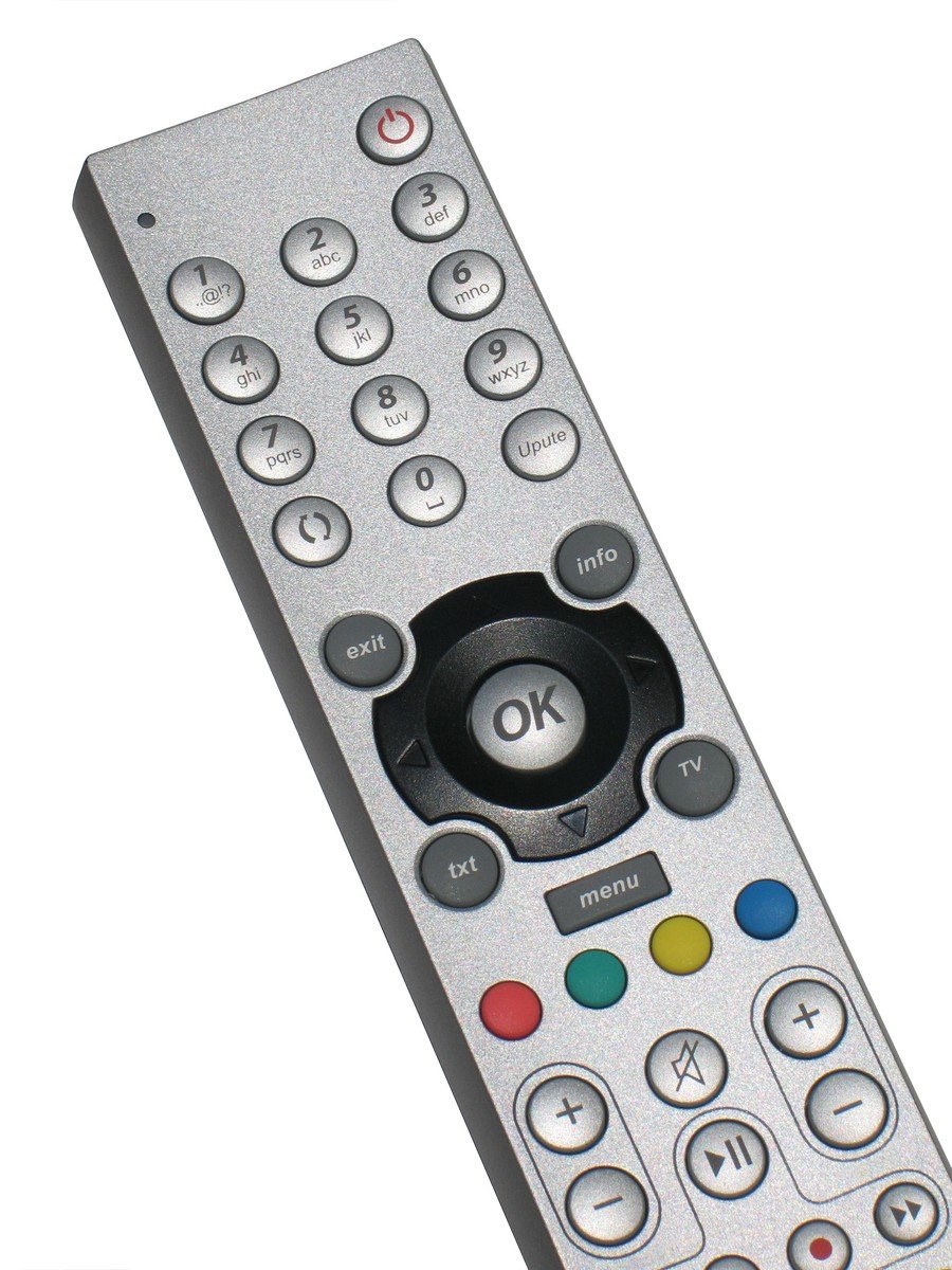 a silver remote control on a white background