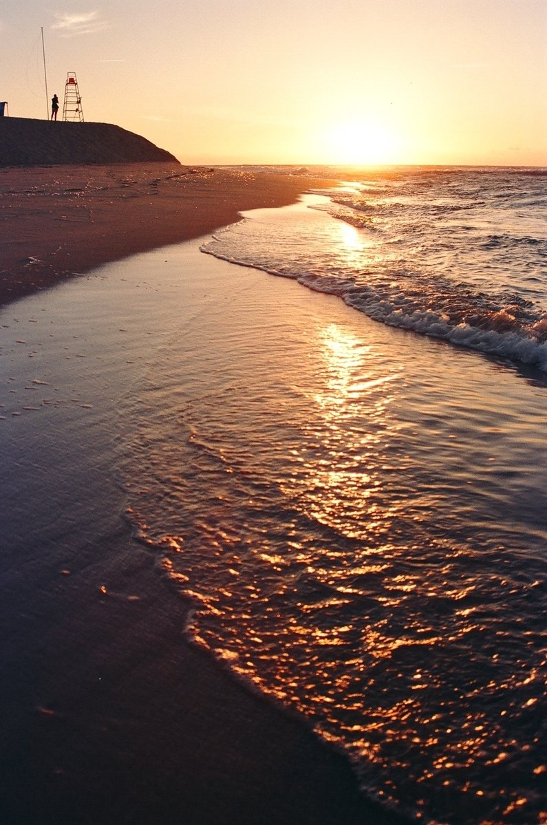 some very pretty water on a beach by the sand