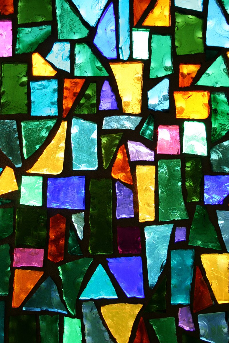 a close up of a colorful stained glass window