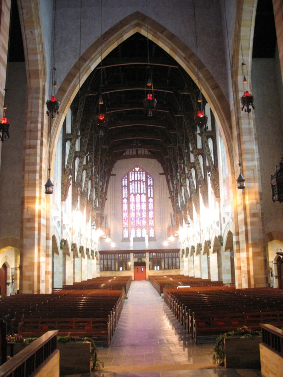 inside the inside of a cathedral with large stained glass windows