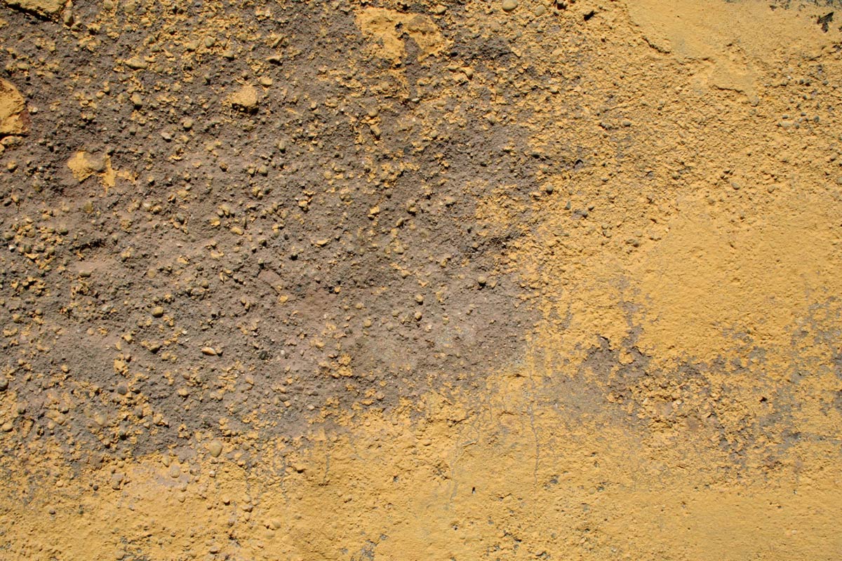 a worn and dirty surface with mud and dirt