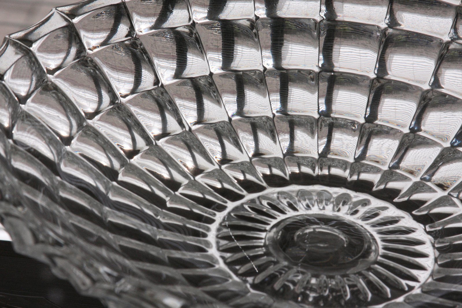 a shiny glass bowl has been designed and polished