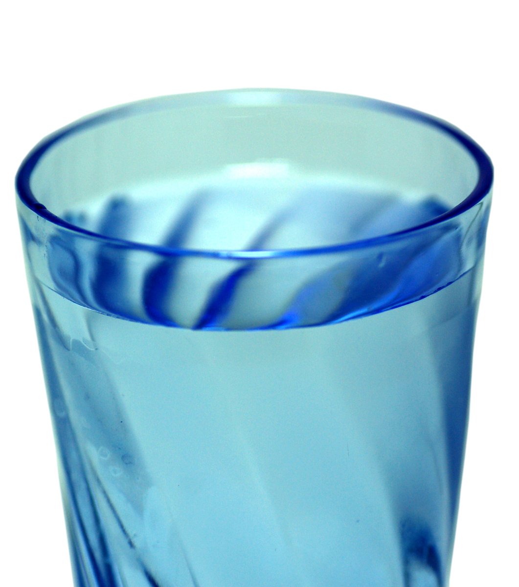 a close up of a glass with blue dye