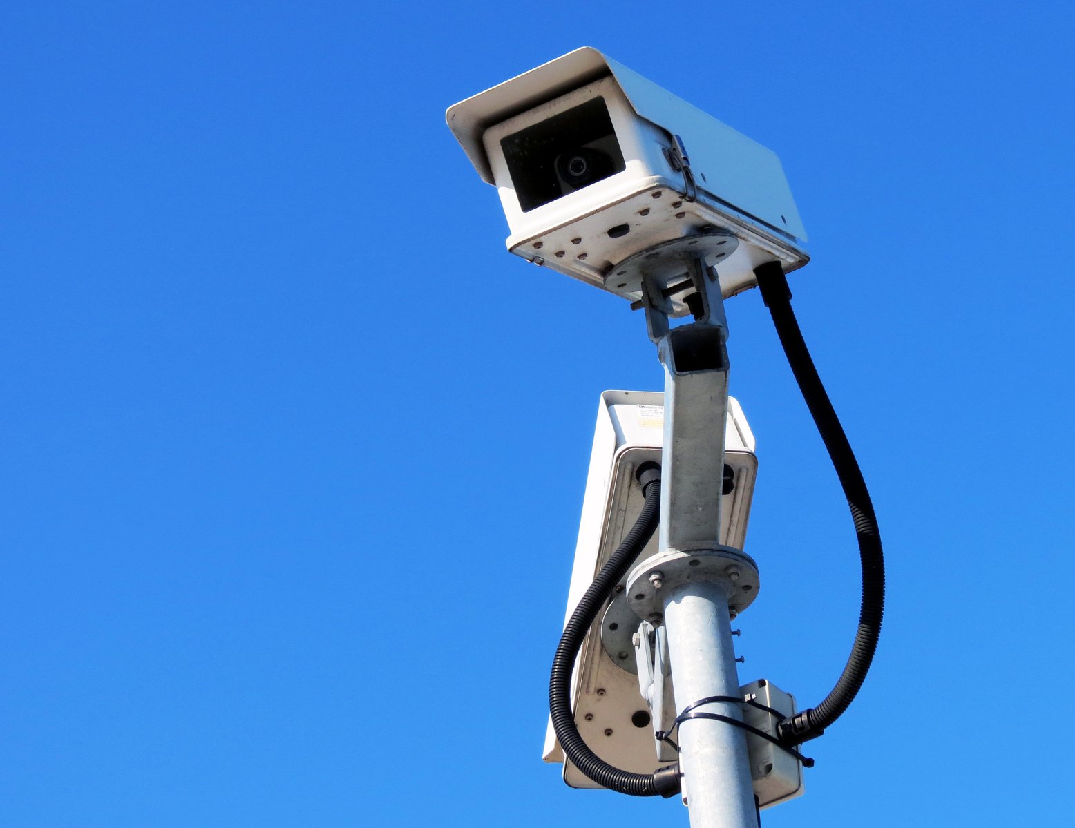 a camera mounted on the side of a pole