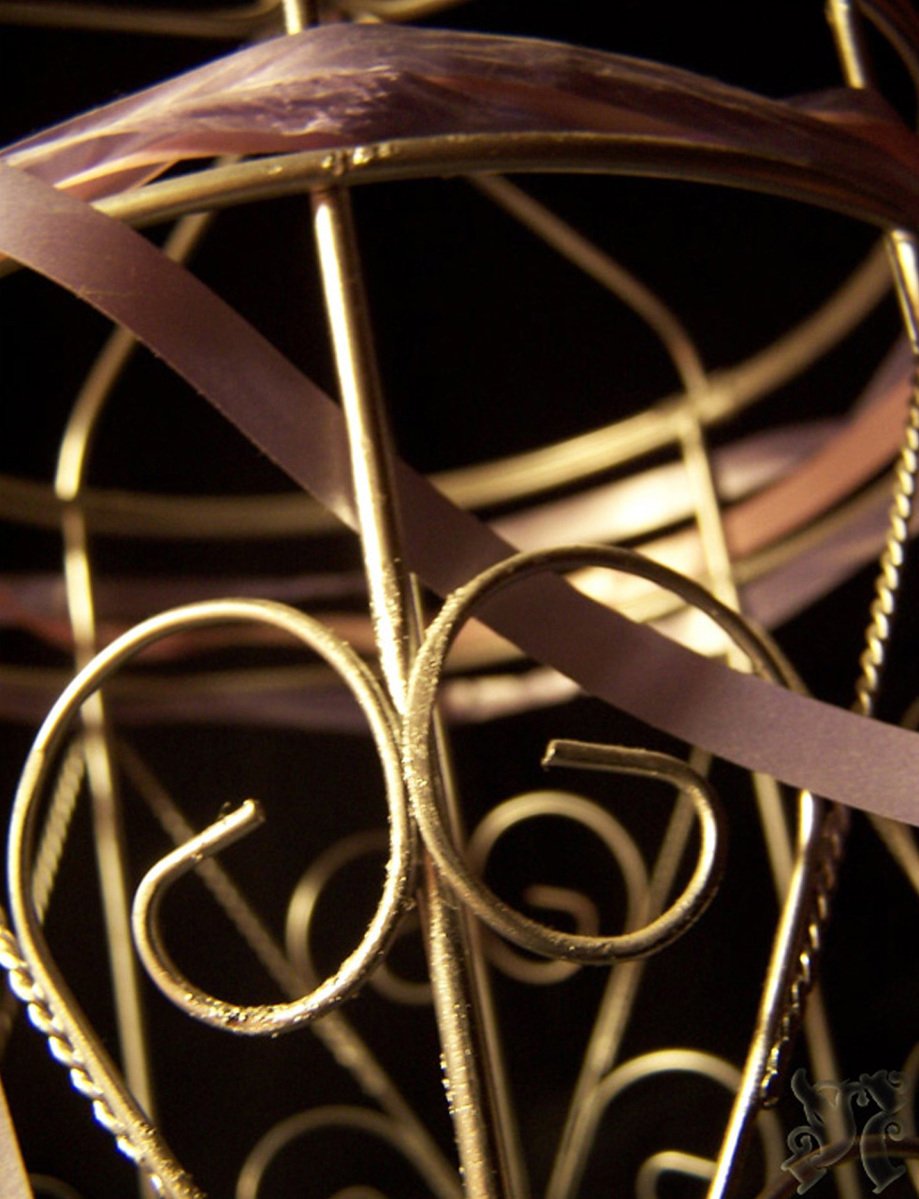 a clock made from metal and gold with decorative design