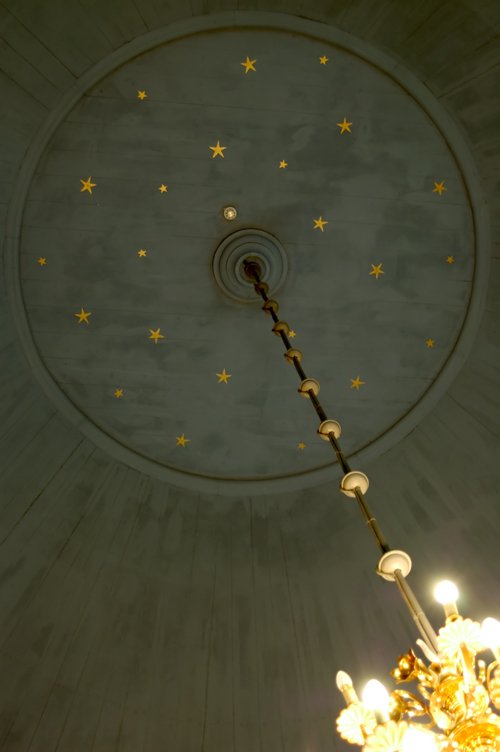ceiling made from circular ceiling tiles and yellow stars