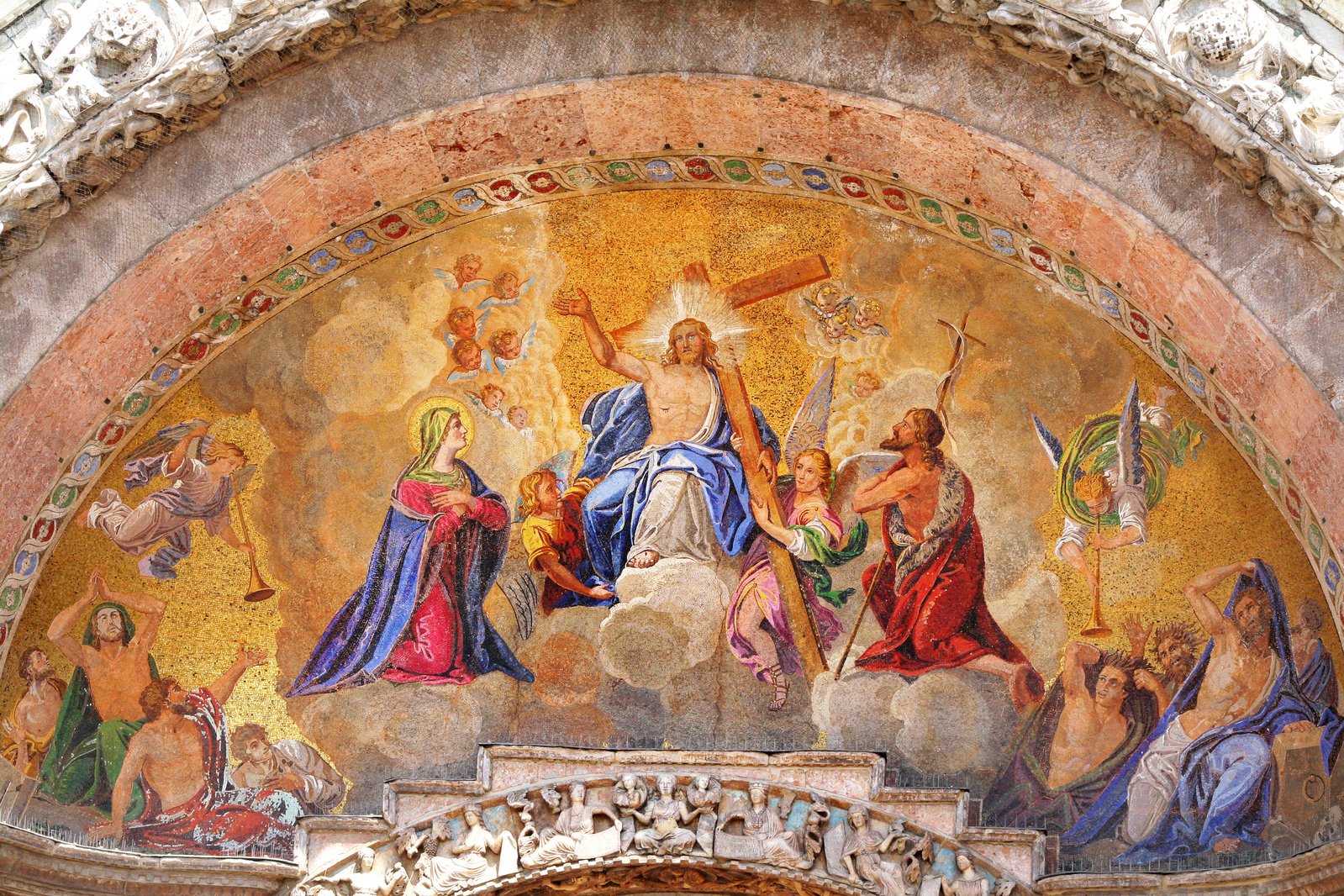 the ornate art on the wall shows many religious figures