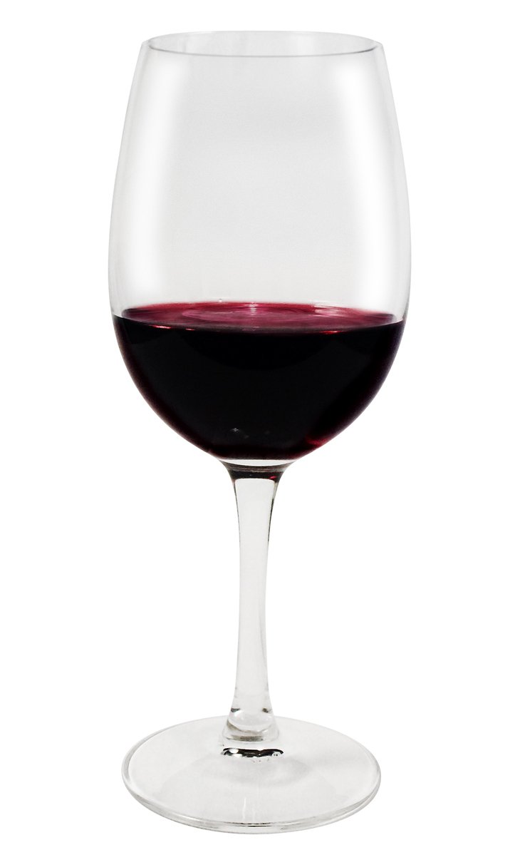 a close up of a glass of red wine on a white surface