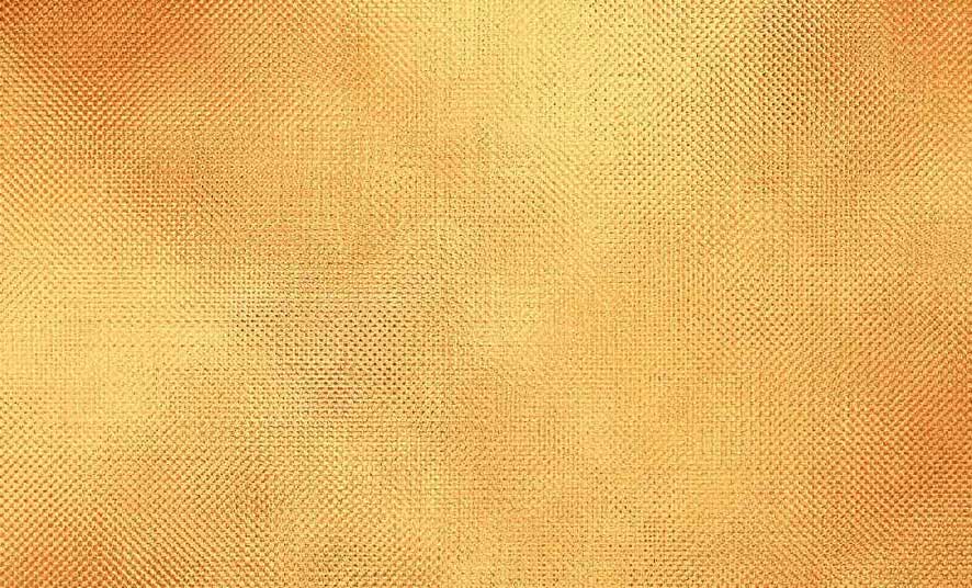 closeup texture of gold color canvas or wallpaper