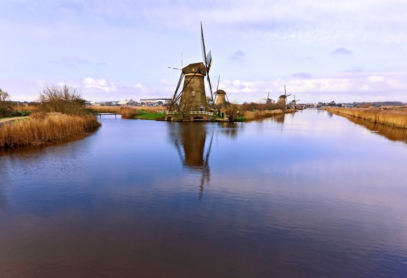 a picture of a small windmill in the water