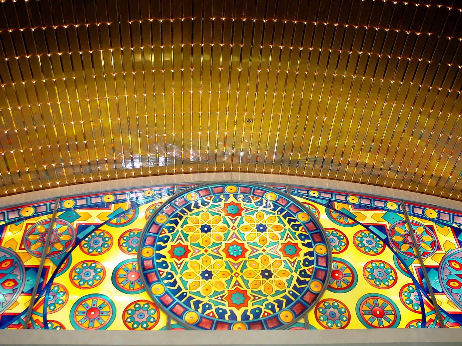 the beautiful ceiling of the shopping mall is adorned with elaborate patterns