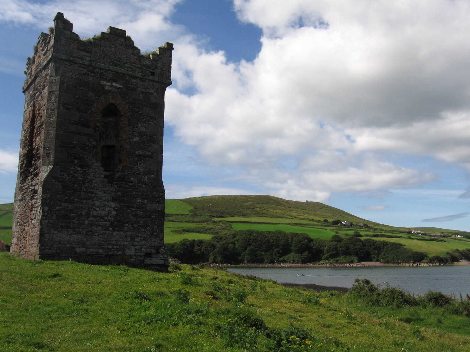 the tower is overlooking a body of water