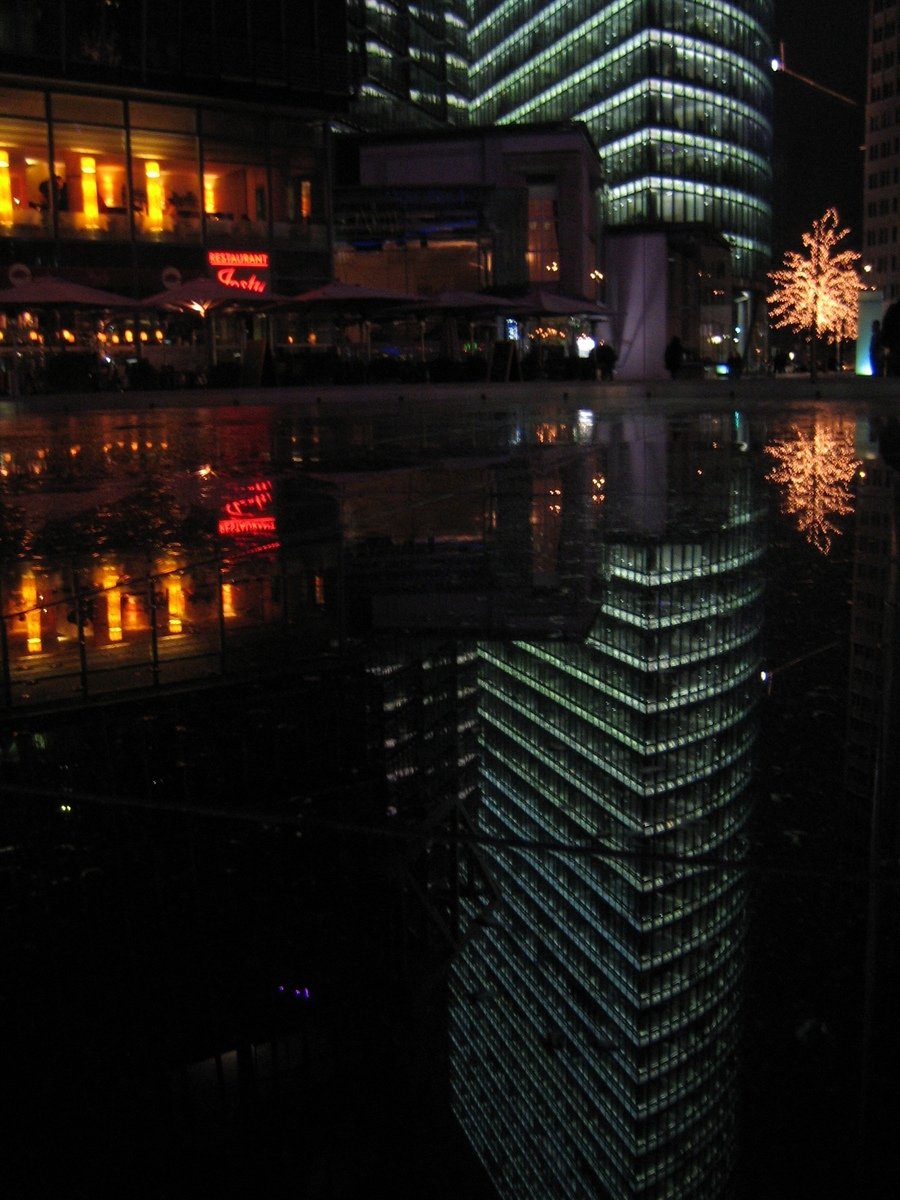 a modern glass building stands in the background