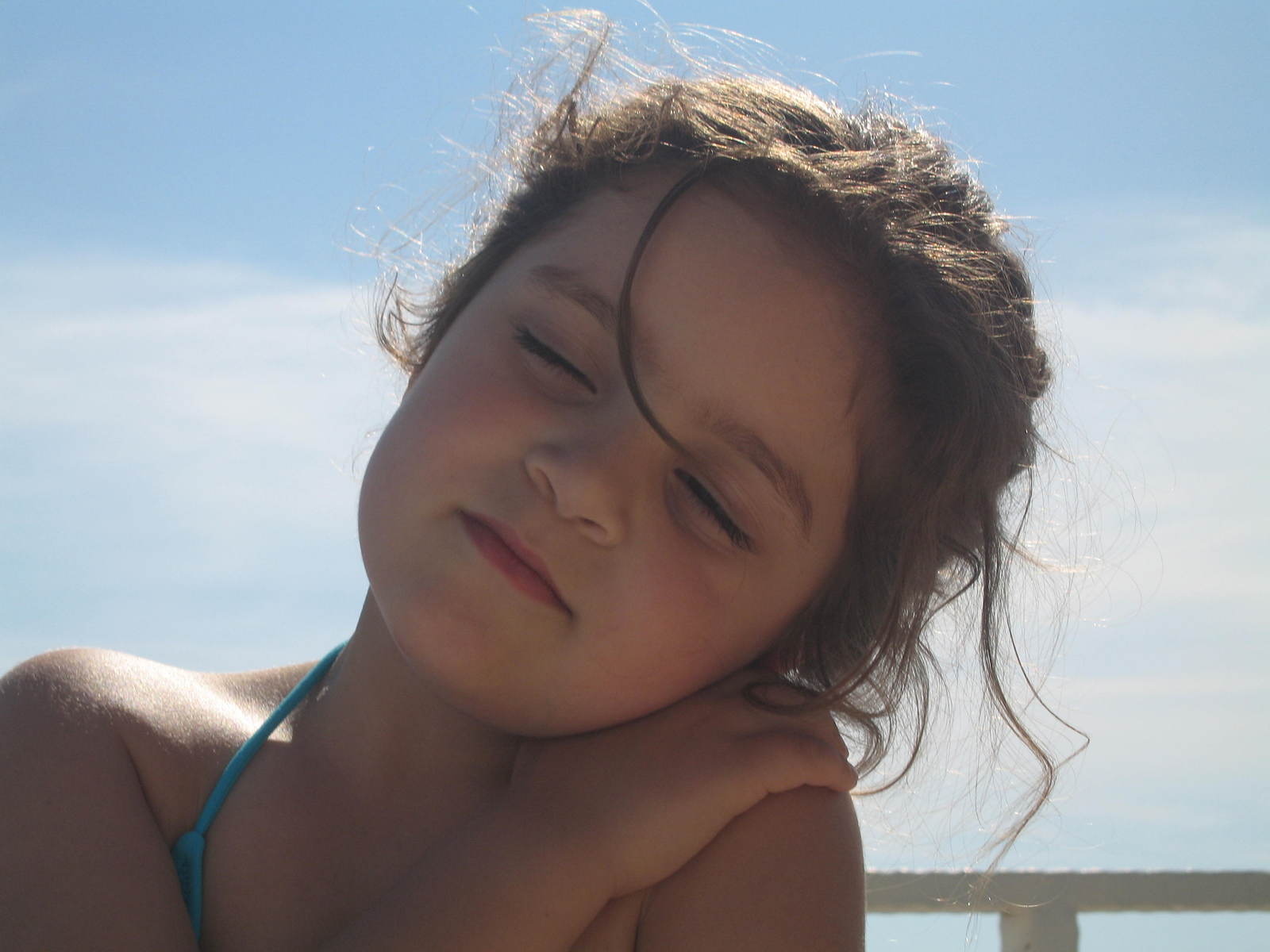 the  is resting her head on the beach