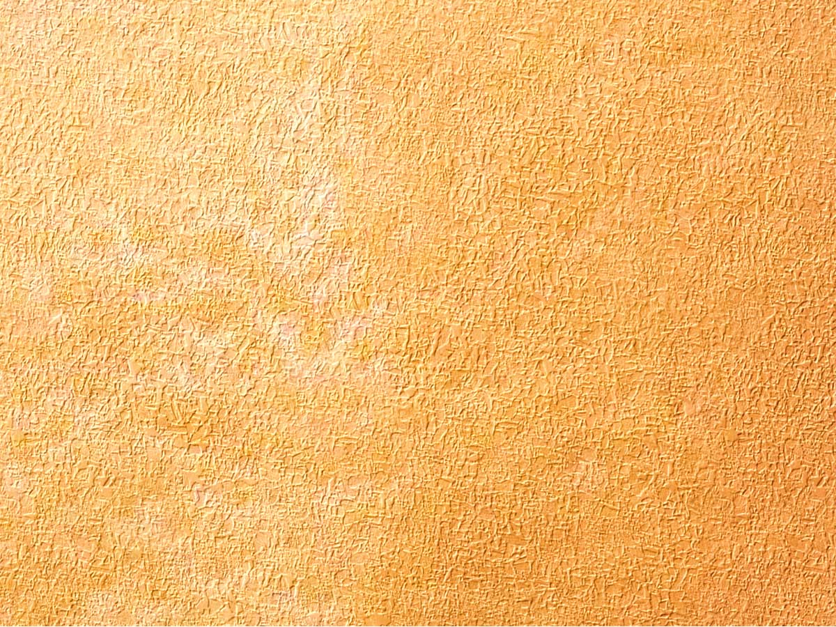 a yellow background that is slightly textured with light brown highlights