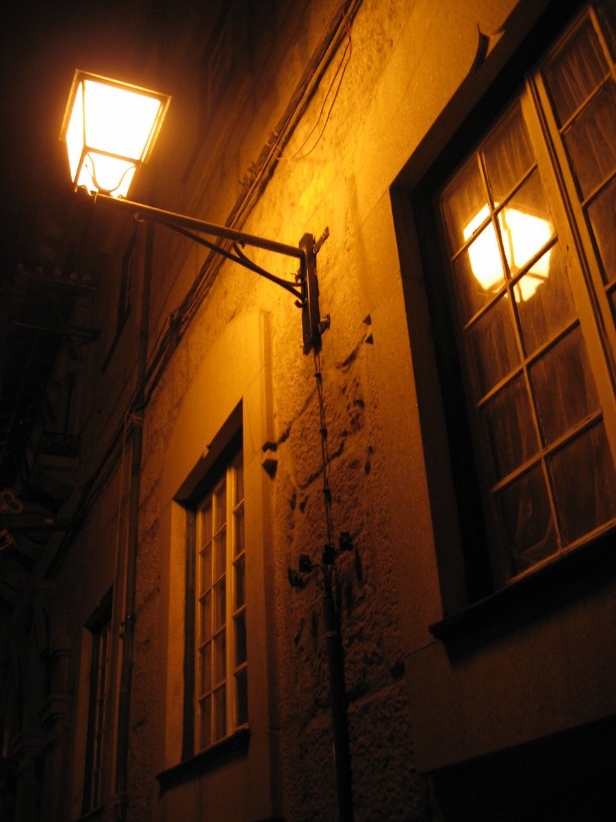 a close up of two lights on a building