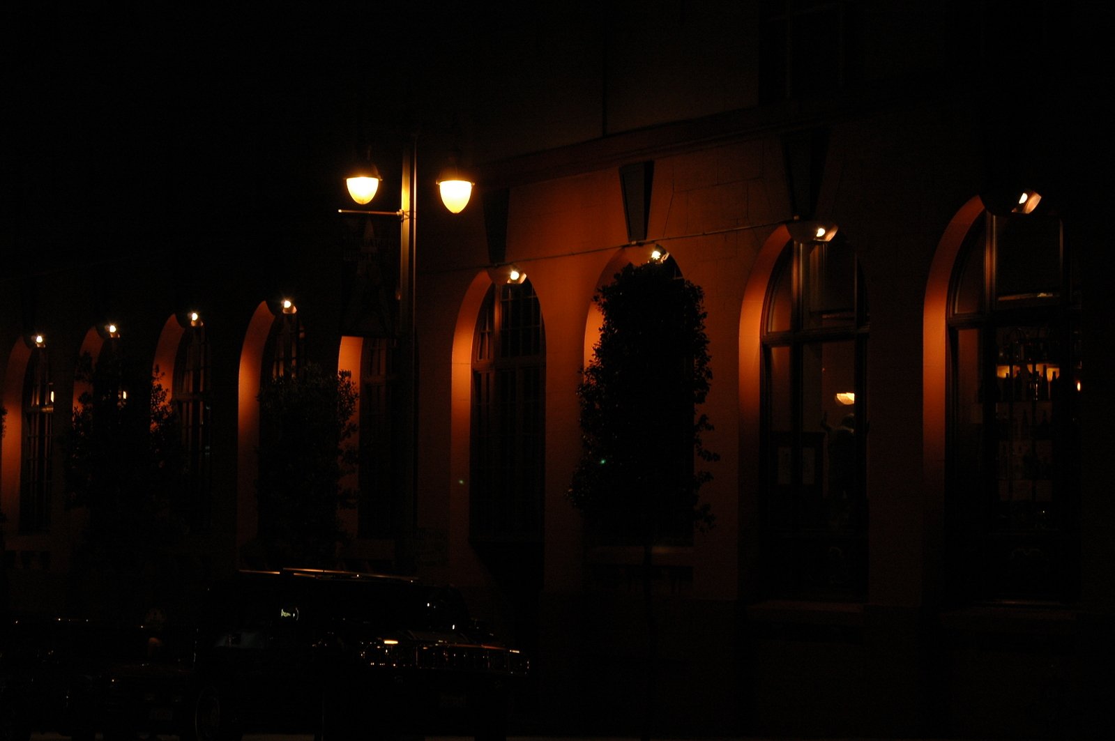 some buildings with streetlights and lighting at night