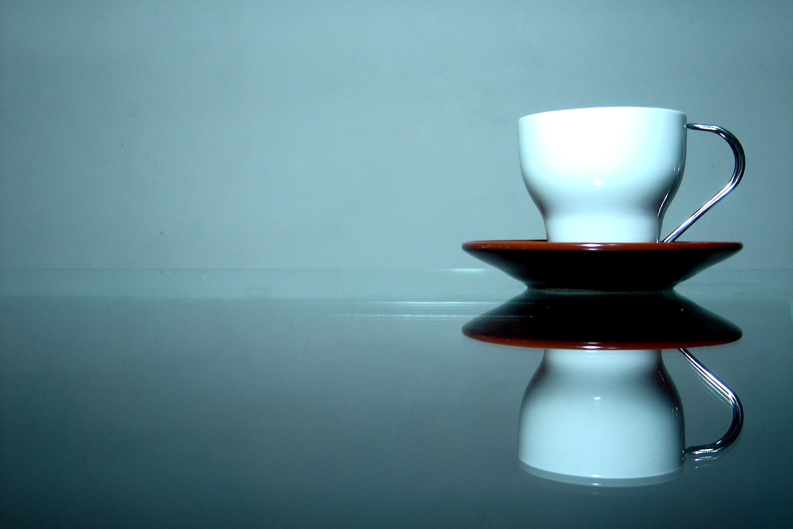 a blue and white mug sitting on top of a table