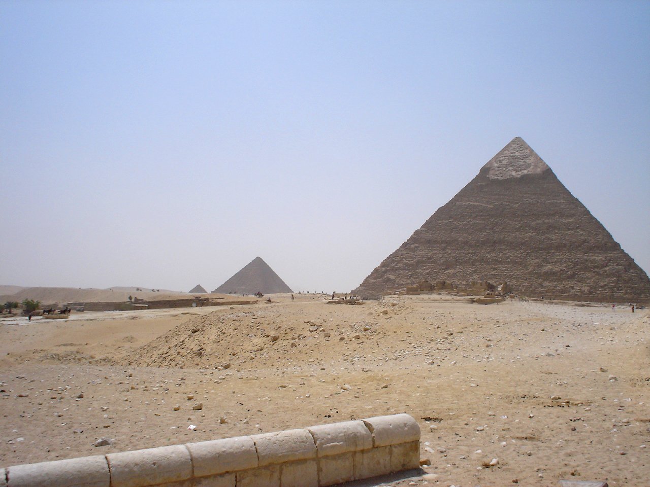 three pyramids are seen in the middle of an area