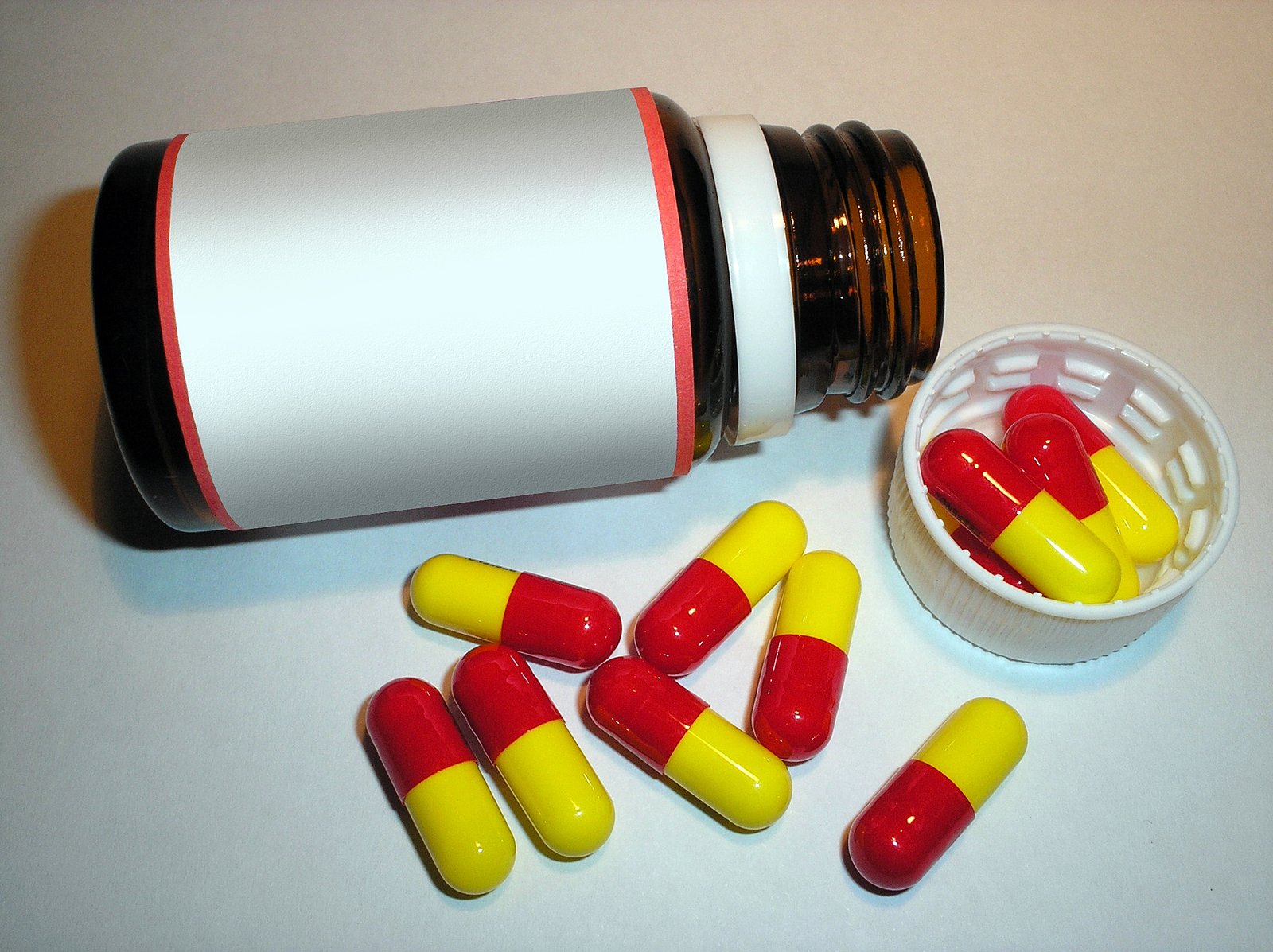 a close up of a container of pills on a table