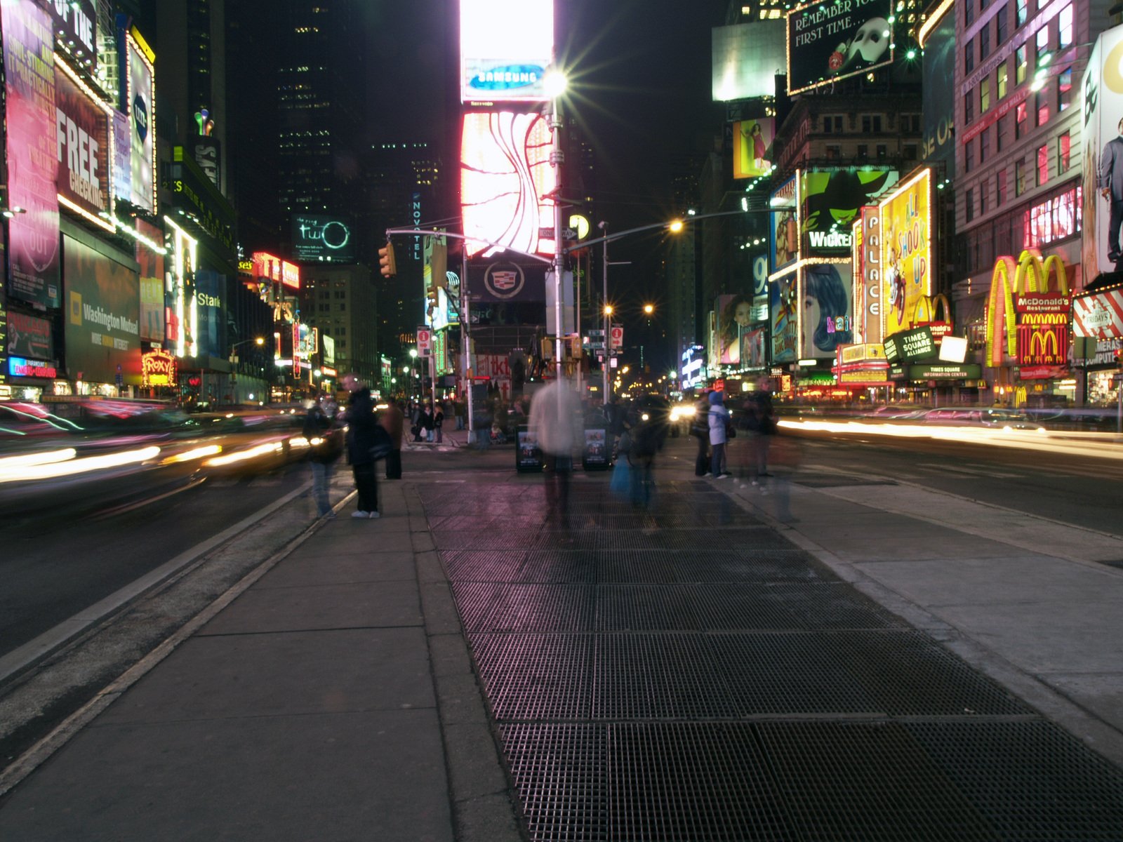 a busy street at night in the city